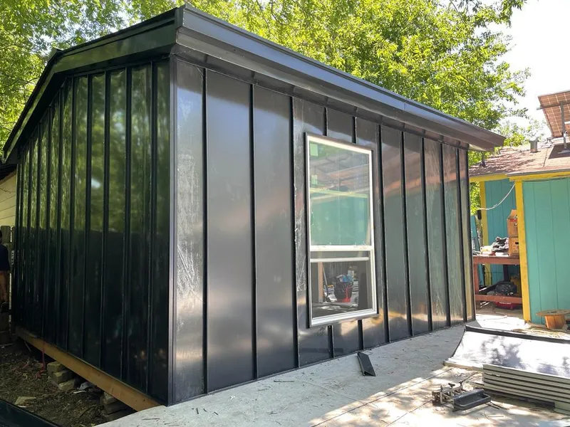 Black standing seam metal wall panels for Roof Inspection in Oyster Bay