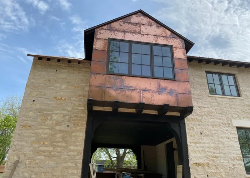 Copper metal panel facade on a stone building for Skylight Installation in Oyster Bay